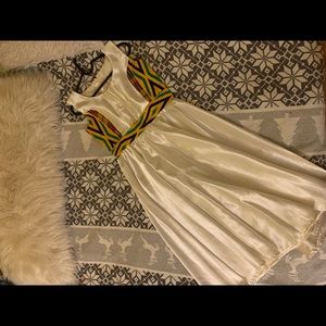 Hand made African style dress, beautiful white color and glossy fabric.
